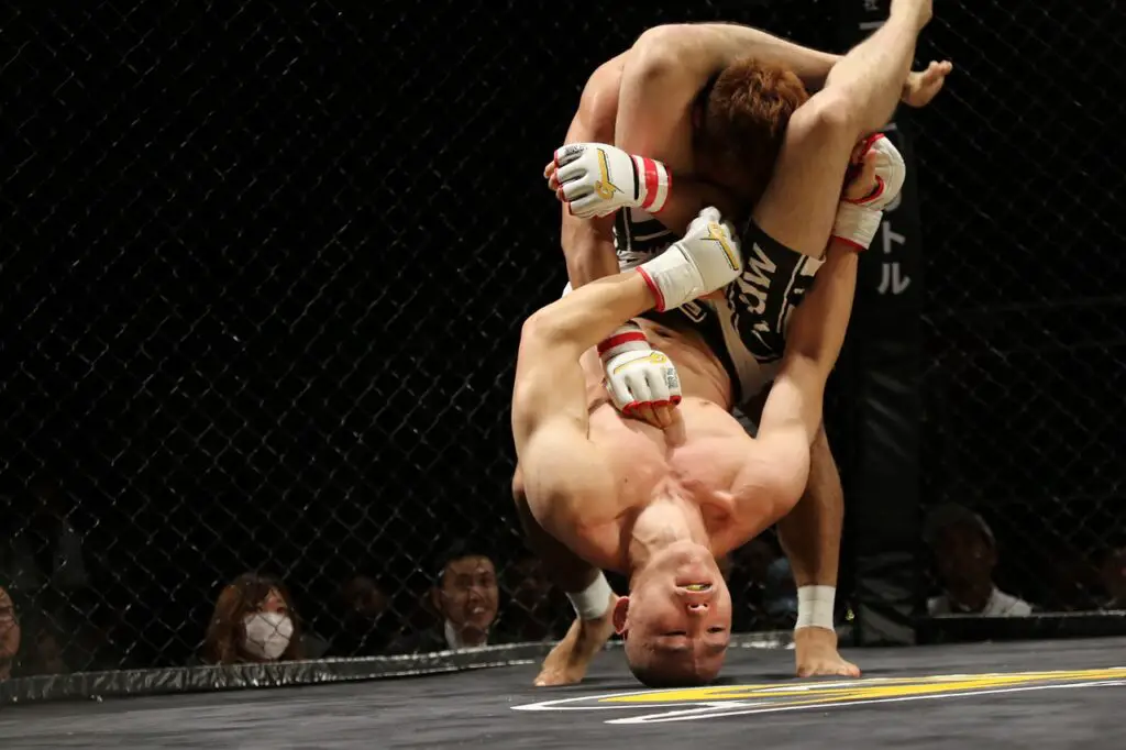 MMA fighter setting up an Armbar submission