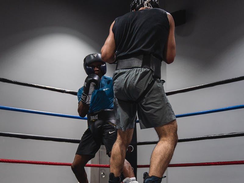 Two boxers sparring in training