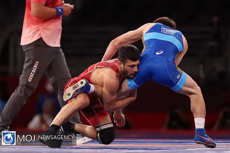 Wrestler executing a single leg takedown