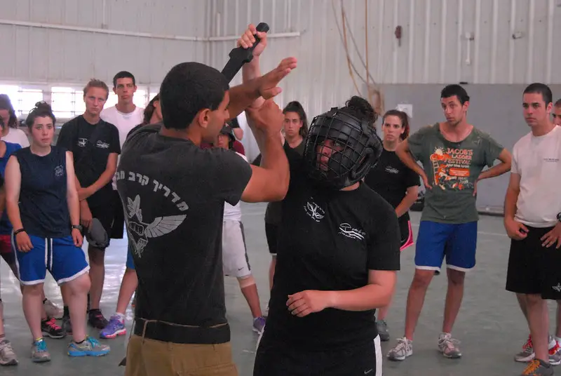 Krav maga student practicing weapon based drills