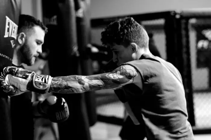 Boxing student practicing punching combos for self defense